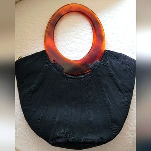 Vintage chic satin fabric design with brown plastic hoop handles clutch bag